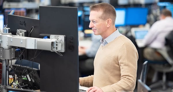 Jeff Koch sitting at computer