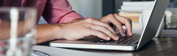 Man typing on laptop